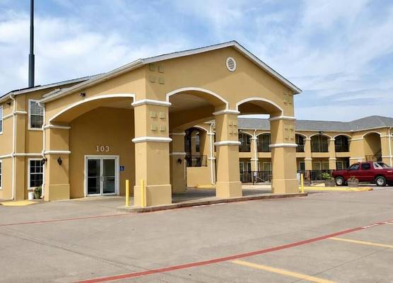 Scottish Inns & Suites Forney 1