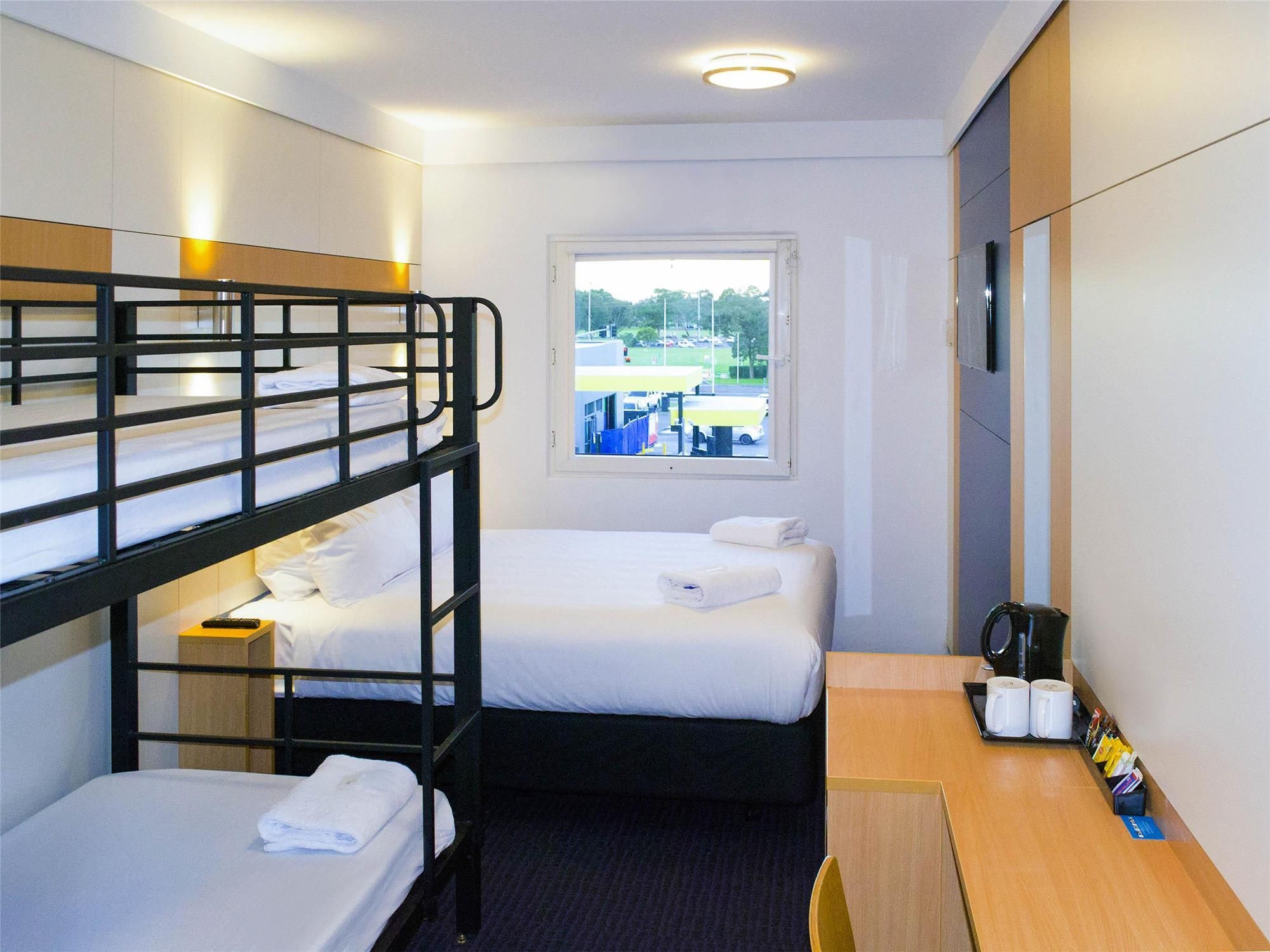 Standard family room with 1 queen bed and 1 set of double-deck bunk beds