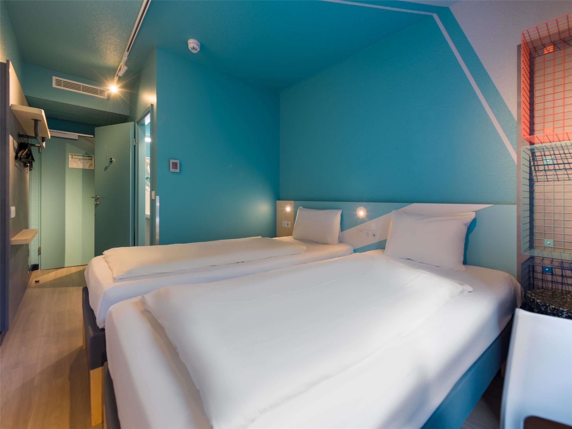 Standard room with a double bed and a loft bed