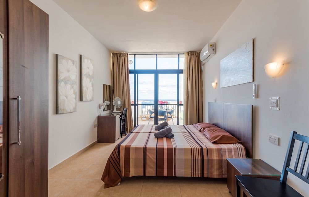 Seashells 2 bedroom Apartment with sunny terrace with stunning panoramic sea views by Getaways Malta 1