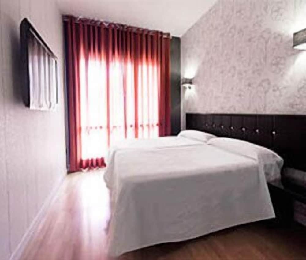Hospedium Hostal Un Punto Chic 1