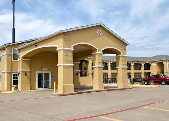 Scottish Inns & Suites Forney 1