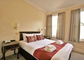 New County Hotel & Serviced Apartments by RoomsBooked 4