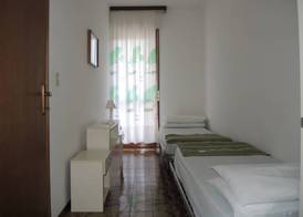 Family apartment steps from Pluto Beach 2