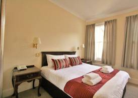New County Hotel & Serviced Apartments by RoomsBooked 4
